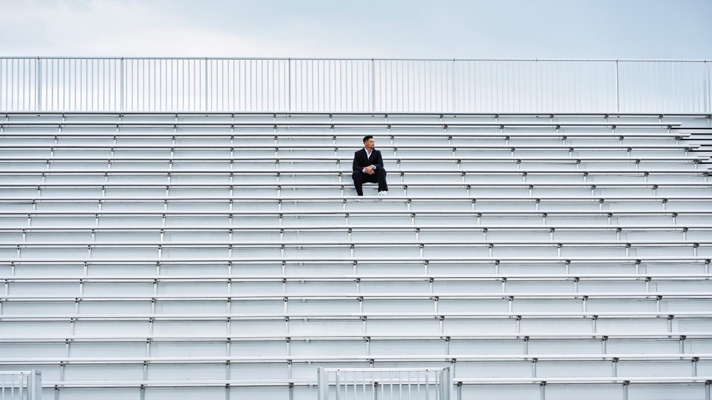 Patrick Mahomes sitting in a stadium