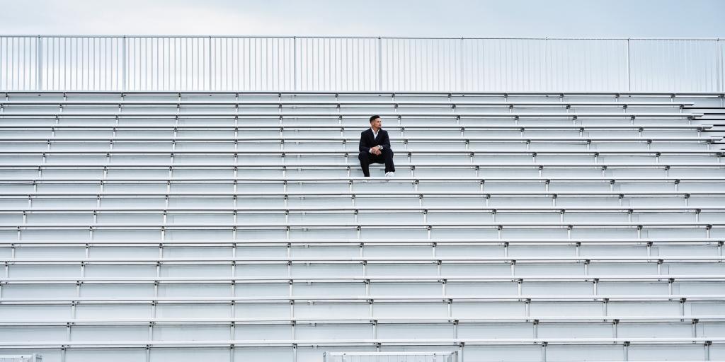 Patrick Mahomes sitting in a stadium
